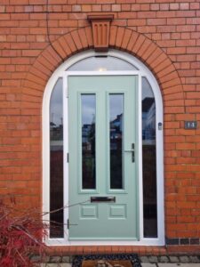 PVCu arched frame with Comp Door solid timber core composite door.