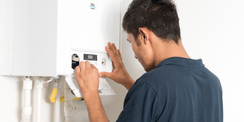man fixing boiler